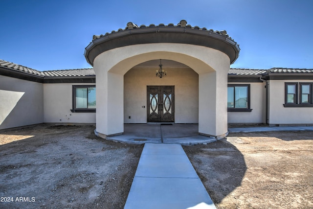 doorway to property featuring french doors