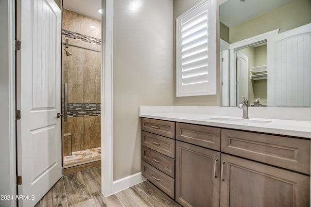 bathroom featuring vanity and a tile shower