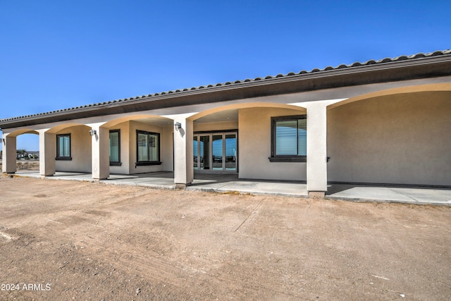 rear view of house featuring a patio