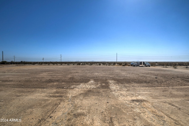 view of yard with a rural view