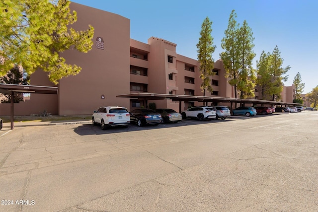 view of property featuring covered parking