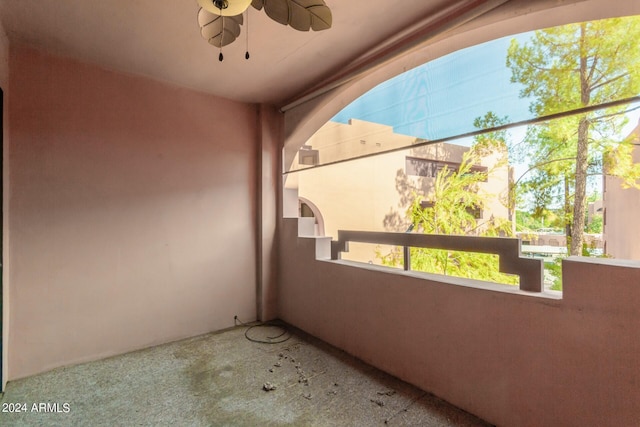 exterior space with a ceiling fan