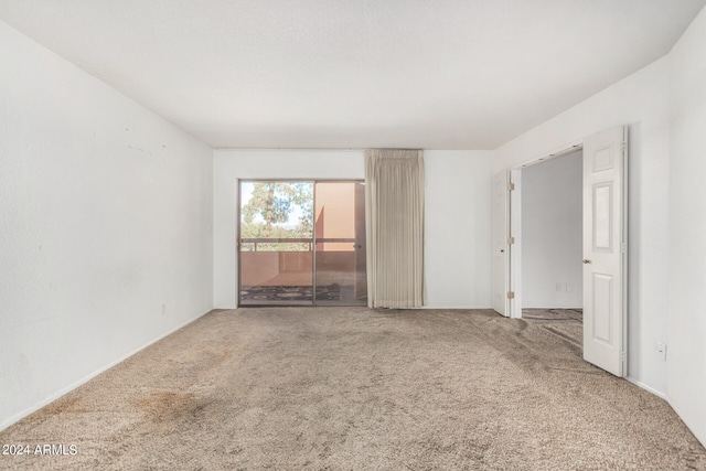 spare room featuring carpet flooring