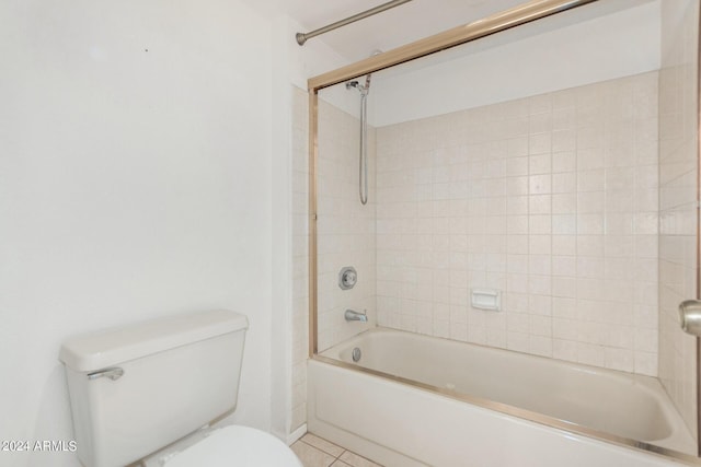 full bath with toilet, tile patterned flooring, and tub / shower combination