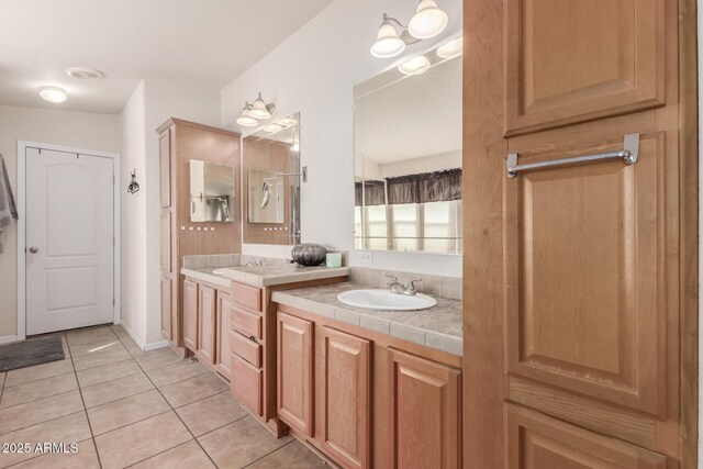 bathroom with tile patterned flooring and vanity