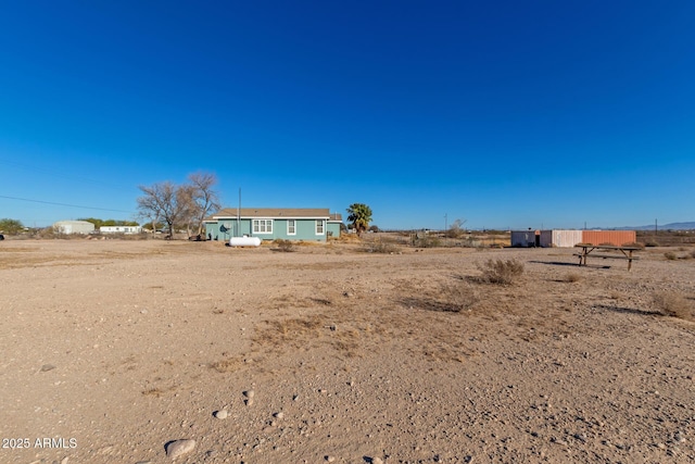 view of yard with a rural view