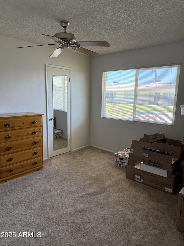 13822 N Silverbell Dr Unit 15C, Sun City, AZ 85351 - unfurnished bedroom with carpet flooring, a textured ceiling, and ceiling fan