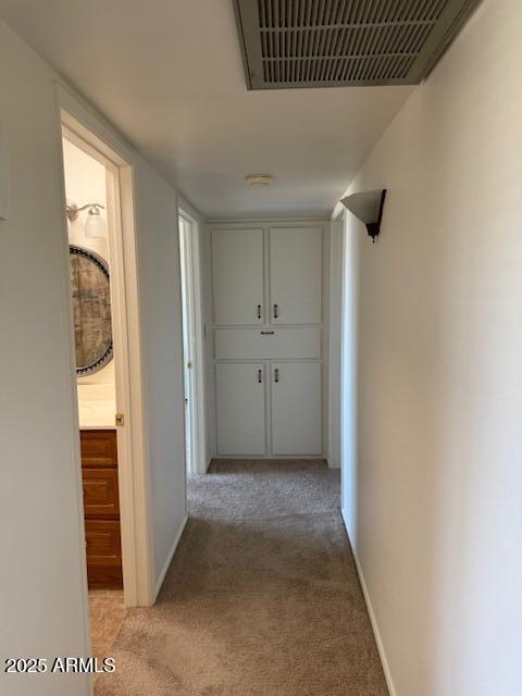 13822 N Silverbell Dr Unit 15C, Sun City, AZ 85351 - hallway featuring light colored carpet and baseboards