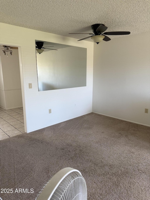 13822 N Silverbell Dr Unit 15C, Sun City, AZ 85351 - carpeted empty room with ceiling fan and a textured ceiling