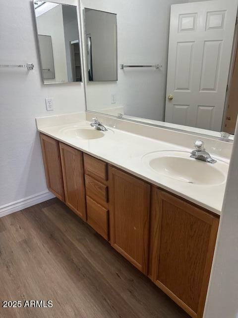 bathroom with hardwood / wood-style flooring and vanity