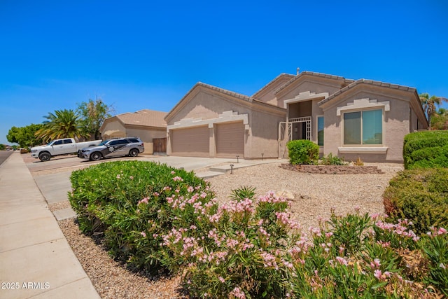 9142 W Pontiac Dr, Peoria, AZ 85382 - ranch-style house featuring an attached garage, concrete driveway, stucco siding, and a tile roof