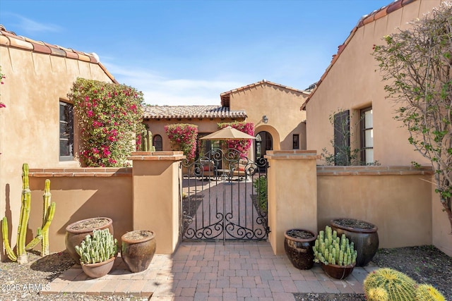 view of gate featuring a fenced front yard