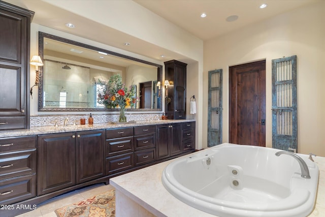 full bathroom with double vanity, a stall shower, a tub with jets, tile patterned flooring, and recessed lighting