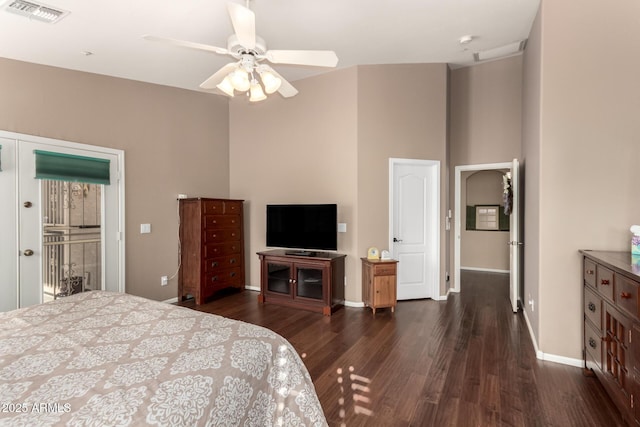 bedroom featuring access to outside, ceiling fan, and dark hardwood / wood-style flooring