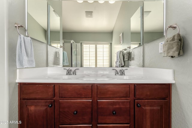 bathroom featuring vanity and an enclosed shower