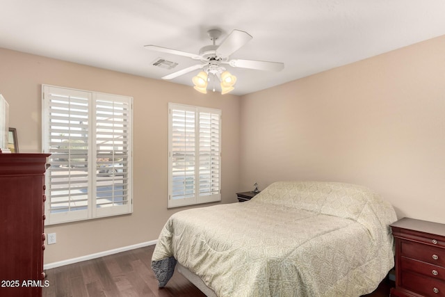 bedroom featuring ceiling fan and dark wood-type flooring