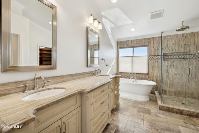 bathroom with crown molding, vanity, and plus walk in shower