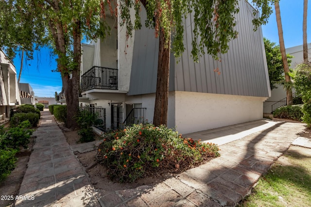 3416 N 44th St Unit 70, Phoenix, AZ 85018 - view of side of home featuring a balcony and stucco siding