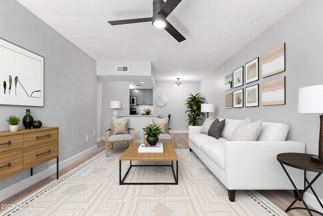3416 N 44th St Unit 70, Phoenix, AZ 85018 - living room with ceiling fan and baseboards
