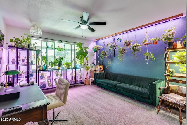 home office with a ceiling fan and carpet flooring