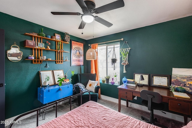 bedroom with ceiling fan, carpet flooring, and baseboards