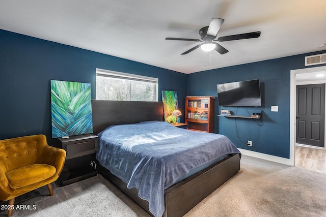 bedroom with carpet, baseboards, visible vents, and a ceiling fan