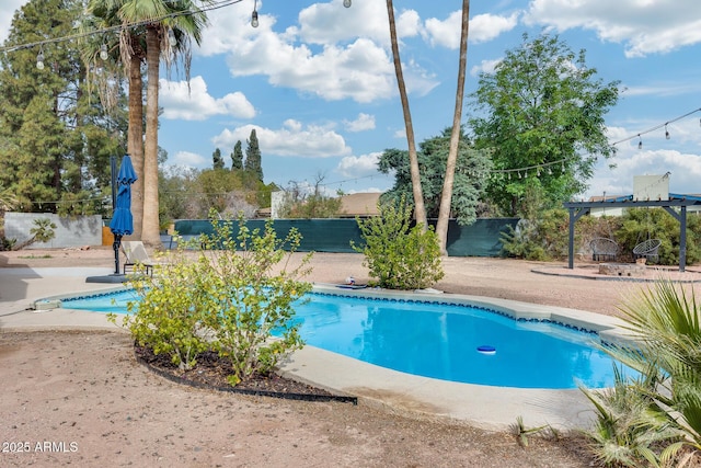 view of pool featuring a patio area, fence, and a fenced in pool