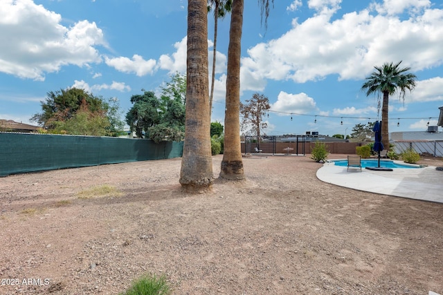 view of yard featuring a fenced in pool, a patio area, and a fenced backyard