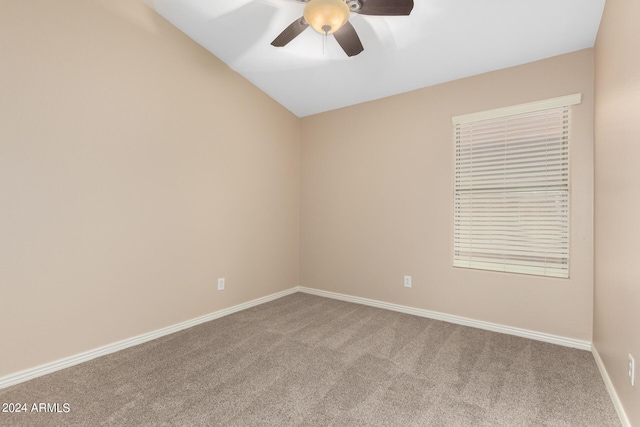 unfurnished room with ceiling fan, lofted ceiling, and carpet