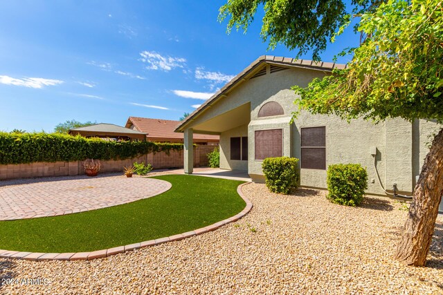 back of house featuring a patio area