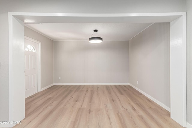 unfurnished room with light wood-type flooring