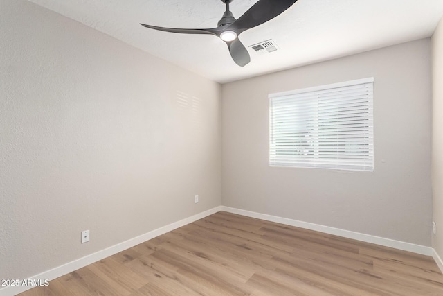 unfurnished room with light hardwood / wood-style flooring and ceiling fan