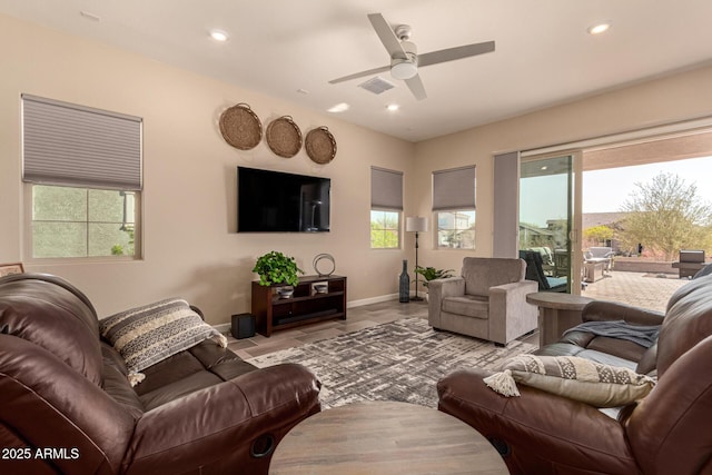 tiled living area featuring a ceiling fan, recessed lighting, visible vents, and baseboards