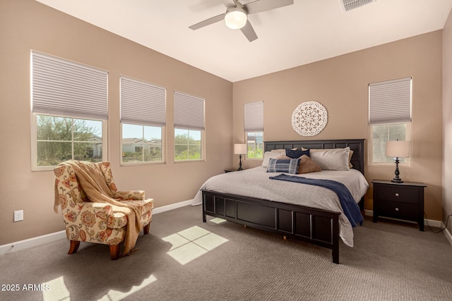 carpeted bedroom with ceiling fan, visible vents, and baseboards