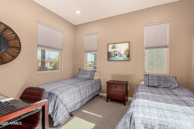 bedroom with carpet and baseboards