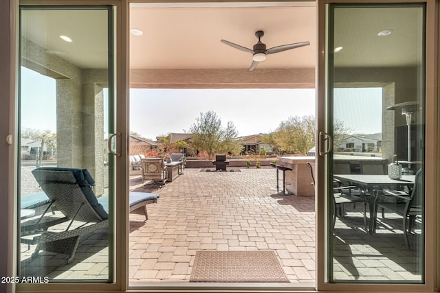 view of patio / terrace featuring ceiling fan and outdoor dining space