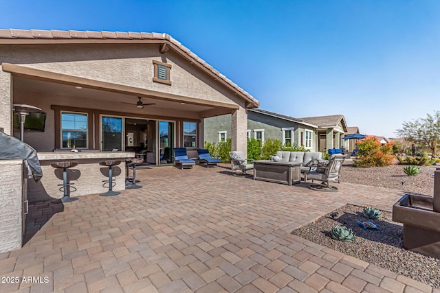 view of patio featuring a ceiling fan, outdoor dry bar, and an outdoor hangout area