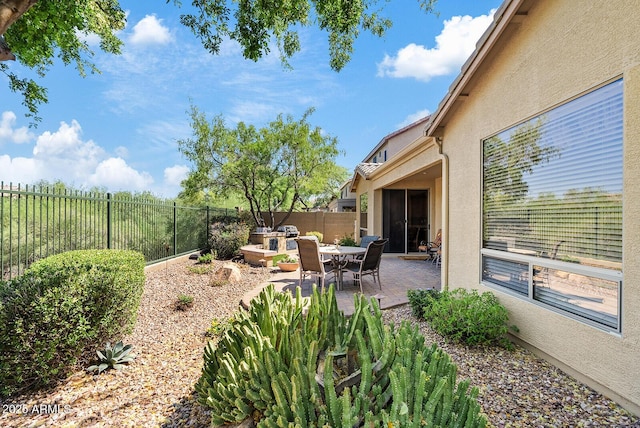 40128 N Integrity Trl, Anthem, AZ 85086 - fenced backyard featuring a patio area