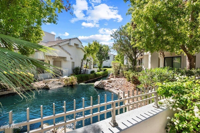 view of swimming pool with a water view