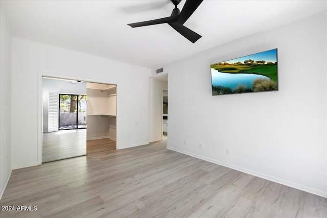 unfurnished room with ceiling fan and light hardwood / wood-style floors