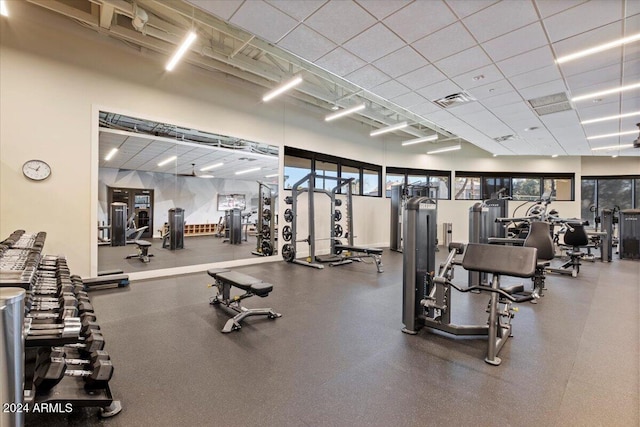 exercise room with a drop ceiling