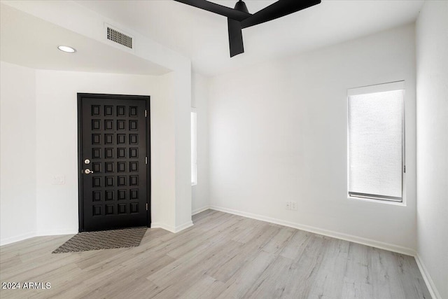 entryway with light hardwood / wood-style floors