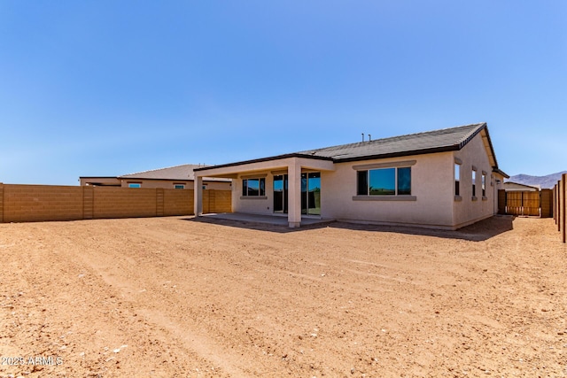 8553 N 175th Ln, Waddell, AZ 85355 - back of house featuring a patio area, a fenced backyard, and stucco siding