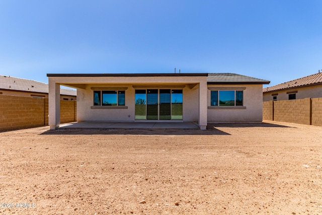 8553 N 175th Ln, Waddell, AZ 85355 - back of house with a patio, a fenced backyard, and stucco siding