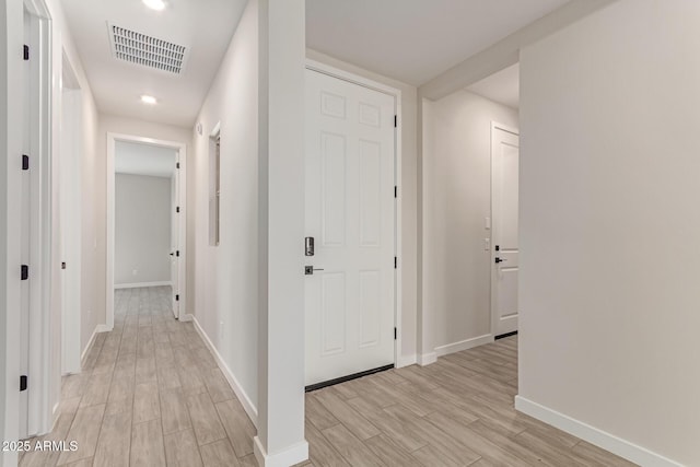 8553 N 175th Ln, Waddell, AZ 85355 - hall with light wood-style floors, baseboards, and recessed lighting