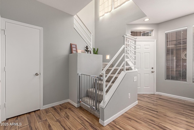 stairway with wood-type flooring