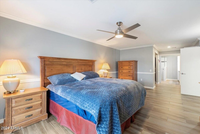 bedroom with light hardwood / wood-style floors, crown molding, and ceiling fan