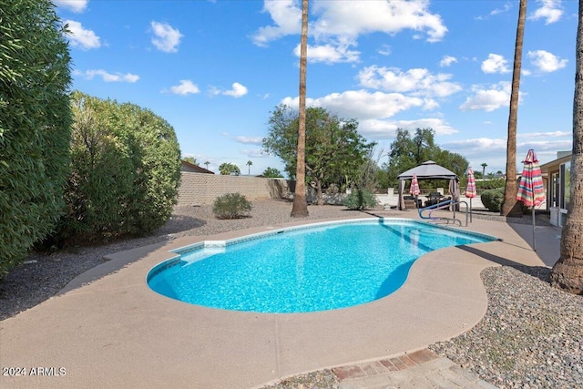 view of swimming pool with a gazebo and a patio