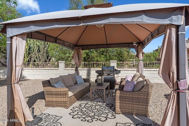 view of patio / terrace with a gazebo, an outdoor hangout area, and a grill