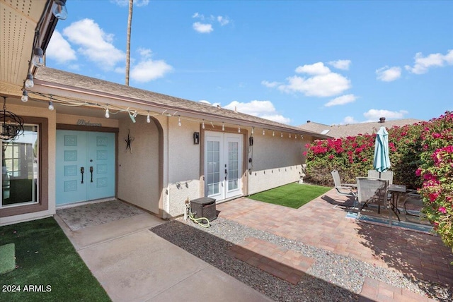 doorway to property with french doors and a patio area